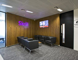 An office with the Skrill logo in it
