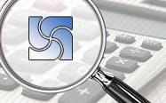 A calculator with a magnifying glass showing the Hedging sign
