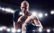 Boxer standing with his hands held high in orthodox stance