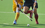 Two field hockey players in-game