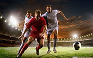 Footballers battling for the ball