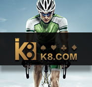 Cyclist with the K8 logo in the foreground
