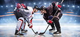 Two hockey players square up for a faceoff.