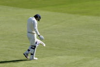 Lonely batsman walking on the cricket field