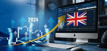 A picture of a computer monitor with a British flag shown. There is also a graph representing the increase in value of the UK gambling market.