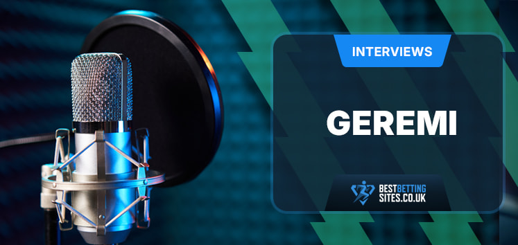 The image features the setup for an interview. On the left is a professional microphone with a pop filter, indicating a recording environment. On the right side of the image is a text box with the word "INTERVIEWS" written at the top in a blue banner. Below it, the name "GEREMI" is prominently displayed. The website "BESTBETTINGSITES.CO.UK" is mentioned at the bottom of the text box. The background is filled with a blue and green geometric pattern, giving a professional and modern appearance.